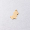 Close-up of golden stainless steel puppy pendant with smooth finish and jump ring - Gold