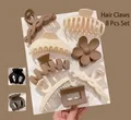Lot de 8 pinces à cheveux aux tons terre mats avec formes florales et géométriques - Café au Lait Coiffure Lot de 10