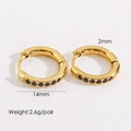 Detailed view of 14mm gold huggie earrings with black crystals and 2mm thickness specs - 14mm Black Zirconia