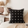 Modern black cushion cover with white cross pattern on a soft beige home sofa - Black Woolen Pillow Cover with White Cross Pattern