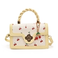 Creamy crossbody bag with red cherry print and golden floral clasp for women - Yellow