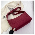 Close-up detail of burgundy corduroy quilted tote bag with soft texture and rhombus pattern - Red