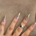 Detail of 3D gold fluid wave stiletto press-on nails with matching gold cross ring accessory - Metallic Fluid Gold Wave (DS33) - Yellow Jelly Glue