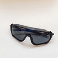 Kids cycling sunglasses in matte black frame with grey lenses and blue anti-slip temple - Black