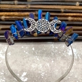 Detailed close-up of handmade moon goddess headband with blue crystals and silver wire - Deep Blue with Stars & Red Moon