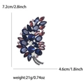 Elegant silver tree brooch with deep blue and wine red rhinestones in a botanical design - Blue and Purple