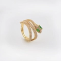 Detail shot of golden snake ring with pink pavé crystals and green zircon eyes - Golden Snake Style 2 (Pink Zircon)