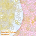 Macro detail of yellow gradient ABS pearl bow-knot accessories for DIY jewelry making - Bow / Gradient Yellow White