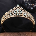 Baroque golden bridal tiara with light blue gemstones and crystals on black background - KC Gold White Rhinestone + Green Opal