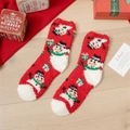 Thick red coral fleece Christmas socks featuring a snowman pattern on wooden floor - One Size / Red Snowman Style