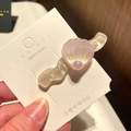 Close-up of pink shell-shaped hair clip with iridescent resin texture and pearl accent - 9# Wavy Large Shell - Pink