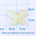 Sparkly yellow resin glitter butterfly charm for DIY crafts and jewelry making - Yellow