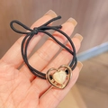 Elastic black hair tie featuring a golden heart pendant with pearl resin inlay - Black Heart Metal Frame Hair Tie 1Pc
