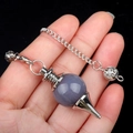 Grey-purple crystal agate sphere pendulum with silver-tone chain held in hand - Grey Agate