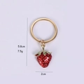 Detail shot of a red 3D strawberry keychain with dimensions 5.8cm height and 2cm width - 3D Strawberry
