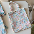 Detailed view of small floral cotton handbag with bronze metal snap button closure - White Base Pink Small Circles(T-24)