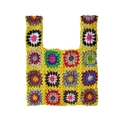 Detailed close-up showing the intricate granny square crochet texture of the handmade bag - Yellow