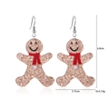 Festive gingerbread man earrings with gold glitter, red scarf, and pearl accents - Pearl Gingerbread Man Earrings