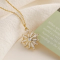 Golden necklace with white enamel sunburst pendant and sparkling cubic zirconia stones - White Sunburst Style / White