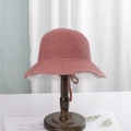 Pink wide-brim woven sun hat with chin strap displayed on a wooden stand - M (56-58cm) / Watermelon red