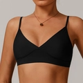 Minimalist black yoga sports bra with thin straps and deep V-neckline in elastic fabric - Premium Black