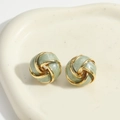 French vintage vortex earrings in gold and bean green enamel on a ceramic tray - Avocado Green
