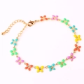 Detail of golden bracelet featuring colorful enamel butterfly charms and lobster clasp - Multicolor Bracelet II
