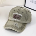 Macro detail of distressed olive green canvas baseball cap with NYC embroidery - Dark Khaki
