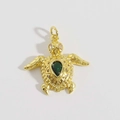 Macro view of turtle pendant with emerald pear-cut stone and 18K gold plated zircon detail - Green Gem Sea Turtle