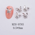 Macro detail of silver butterfly nail charms with 9.5x9mm dimensions on pink fake nails - Clear White Silver Base Style (MZH-9785)