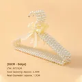 Eleganter beiger Perlenkleiderbügel mit Schleife für Tier- und Kinderkleidung, 30cm - 30cm / Beige