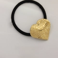 Minimalist elastic hair tie with a textured gold heart-shaped metal alloy charm - Pattern Heart Gold