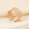 Macro detail of rose gold hollow chain ring on beige silk background showing metal texture - Hollow Chain Style (KR105270--KFC) / Rose Gold