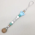 Close-up of baby pacifier clip with beech wood, silicone crown and BABY letter beads - Sky Blue