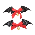 Close-up of Halloween bat wing hair clips with red bows and gold bells on white background - Lolita Black Bat Hair Clips