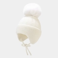 Detail of white knit earflap hat with large faux fur pompom and ribbed texture - White
