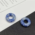 Detailed view of two blue and white natural sodalite stone beads with large inner holes - Blue Spot Jasper