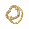 Macro detail of intertwined gold heart ring with pavé set cubic zirconia stones - Gold Hollow Heart Style