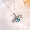 Detail view of silver travel charms including airplane, globe and suitcase on a necklace - Silver Airplane Earth Style C