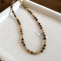 Detailed view of vintage tiger eye bead necklace displayed in a white jewelry box - 54# Gold Coffee Necklace