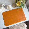 Orange faux leather placemat with scallop edges and vintage embossed totem patterns - Embossed Totem Orange