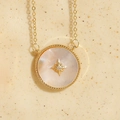 Star and moon disc pendant necklace with white mother of pearl in 14K gold plated finish - Round Starburst Shell / Gold