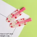 Detailed view of pink cherry acrylic hair clips with dimensions 6.1cm by 1.8cm - Rose Pink Cherry