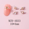 Macro shot of 10x4mm amber heart wing nail charms with metallic base and zircon - Amber Style (AB33) / 10 Pieces Pack