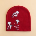 Red street style beanie with gray and white abstract portrait jacquard knit pattern - Red
