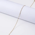 Elegant gold stainless steel shimmering necklace draped on a white minimalist pedestal - 45+5cm / 1.3mm Starry Chain / Gold