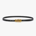 Elegant thin black leather belt for women featuring a wavy gold metal buckle closure - Black