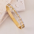 Brazalete ondulado bicolor en oro y plata con detalles de circonitas brillantes - Ola