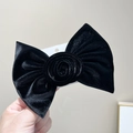 Detail of a large black velvet bow hair clip with a stylish central rose flower design - Black Velvet Single Layer Bow with Rose Flower Hair Clip