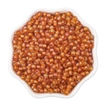 Vibrant orange 4mm iridescent glass seed beads in a white petal-shaped bowl for DIY jewelry - 4mm / Bright Orange (#06 Style)